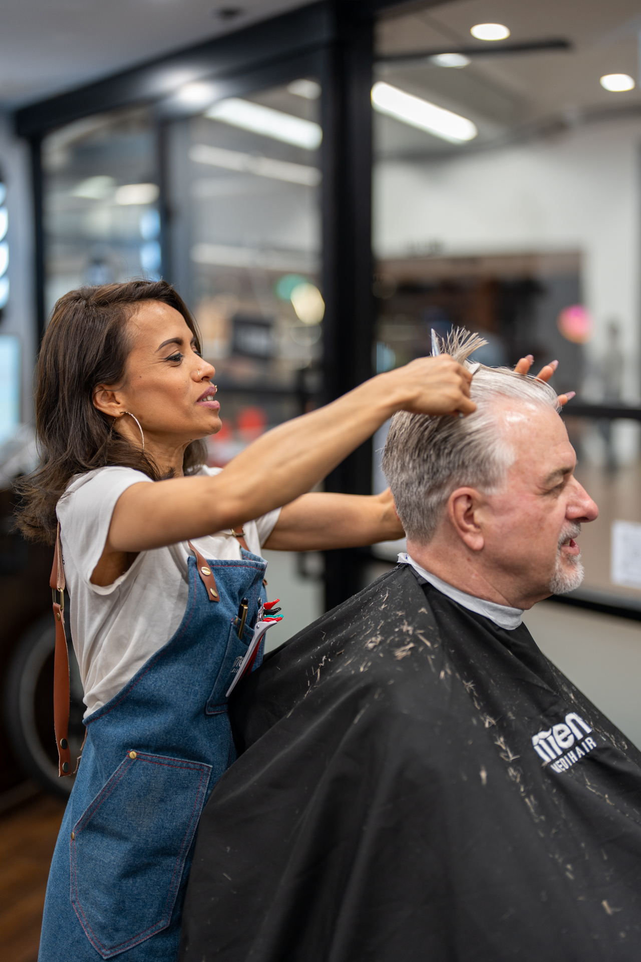 Stylist Cutting Client's Hair